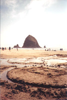 Haystack Rock Amid Swirling Sand